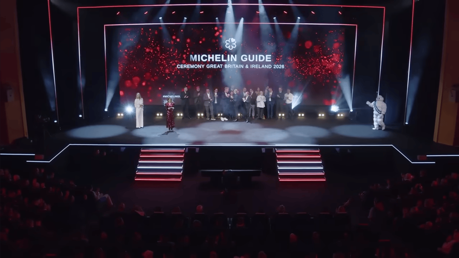 Dignitaries and guests attending the 2026 awards ceremony in a grand hall featuring elegant decorations and ambient lighting